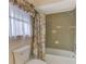 Bathroom with shower/tub combo and floral curtain at 519 Rubens Dr # 519, Nokomis, FL 34275