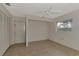 Simple bedroom with wood-look floors and ample closet space at 519 Rubens Dr # 519, Nokomis, FL 34275