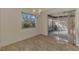 Casual dining area with sliding glass doors leading to a sunroom at 519 Rubens Dr # 519, Nokomis, FL 34275