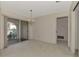 Simple dining room with a chandelier and sliding glass doors to patio at 519 Rubens Dr # 519, Nokomis, FL 34275
