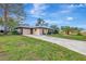 Exterior of house showcasing the garage and front yard at 519 Rubens Dr # 519, Nokomis, FL 34275