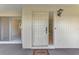 Exterior front door with sidelights and welcome mat at 519 Rubens Dr # 519, Nokomis, FL 34275