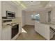 Efficient kitchen with modern appliances and light wood flooring at 519 Rubens Dr # 519, Nokomis, FL 34275