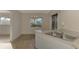 Clean kitchen featuring a double sink and ample counter space at 519 Rubens Dr # 519, Nokomis, FL 34275
