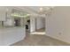 Kitchen features light cabinets, appliances, and wood-look floors at 519 Rubens Dr # 519, Nokomis, FL 34275