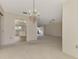 Spacious living room with carpeting and access to dining area at 519 Rubens Dr # 519, Nokomis, FL 34275