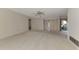 Bright living room with neutral carpeting and access to other rooms at 519 Rubens Dr # 519, Nokomis, FL 34275