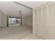 Living room with sliding doors leading to a screened patio at 519 Rubens Dr # 519, Nokomis, FL 34275