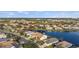 Aerial view of a residential community with houses, lakes, and lush greenery at 5217 Layton Dr, Venice, FL 34293