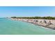 Expansive beach with people enjoying the sun at 545 Warwick Ln, Venice, FL 34293