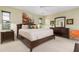 Spacious main bedroom with a king-size bed and plenty of dresser space at 545 Warwick Ln, Venice, FL 34293