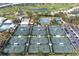 Eight well-maintained tennis courts with surrounding landscape at 545 Warwick Ln, Venice, FL 34293