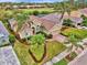 Landscaped property with palm trees and brick driveway at 5561 White Ibis Dr, North Port, FL 34287