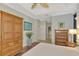 Spacious bedroom with wood floors and built-in wardrobe at 5561 White Ibis Dr, North Port, FL 34287