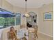 Charming breakfast nook featuring a round table and wicker chairs at 5561 White Ibis Dr, North Port, FL 34287