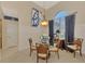 Elegant dining room with glass-top table and four chairs at 5561 White Ibis Dr, North Port, FL 34287