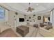 Gathering room with built-in shelving and access to kitchen at 5561 White Ibis Dr, North Port, FL 34287