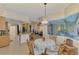 Kitchen with breakfast nook, island, and view to backyard at 5561 White Ibis Dr, North Port, FL 34287