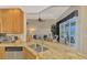 Large kitchen with double sink, granite counters, and stainless steel appliances at 5561 White Ibis Dr, North Port, FL 34287