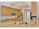 Modern kitchen with granite countertops and stainless steel sink and faucet at 5561 White Ibis Dr, North Port, FL 34287