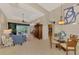 Spacious living room with comfortable seating, large windows and pool view at 5561 White Ibis Dr, North Port, FL 34287
