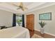 Main bedroom with wood floors, and backyard access at 5561 White Ibis Dr, North Port, FL 34287