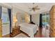 Main bedroom with wood floors and access to the pool at 5561 White Ibis Dr, North Port, FL 34287
