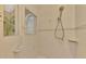 Clean shower with tiled walls and a rainfall shower head at 5561 White Ibis Dr, North Port, FL 34287