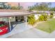 Condo with carport and landscaping visible at 6246 Green View Cir # 97, Sarasota, FL 34231