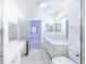 Bathroom with double vanity, toilet, and access to bedroom at 6246 Green View Cir # 97, Sarasota, FL 34231