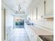 Efficient kitchen with white cabinets and tile floor at 6246 Green View Cir # 97, Sarasota, FL 34231