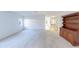 Bright living room with carpet, large windows, and built-in hutch at 6246 Green View Cir # 97, Sarasota, FL 34231