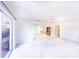 Open living room with view into another room, carpet flooring and sliding doors at 6246 Green View Cir # 97, Sarasota, FL 34231