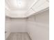 Spacious walk-in closet with wire shelving and carpet flooring at 6246 Green View Cir # 97, Sarasota, FL 34231