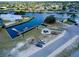 Aerial view of waterfront property with boat slips at 6670 Harmony Rd, North Port, FL 34287