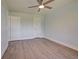 Spacious bedroom with two closets and wood-look floors at 6670 Harmony Rd, North Port, FL 34287