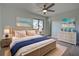 Primary bedroom with wicker bed frame and coastal decor at 6670 Harmony Rd, North Port, FL 34287