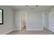 Bedroom with ensuite bathroom and wood-look floors at 6670 Harmony Rd, North Port, FL 34287