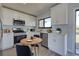 Modern kitchen with stainless steel appliances and white cabinets at 6670 Harmony Rd, North Port, FL 34287