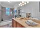 Clean bathroom with a tub shower combo and modern vanity at 702 Granada Ave # 7, Venice, FL 34285