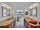 Double vanity bathroom with access to bedroom at 702 Granada Ave # 7, Venice, FL 34285