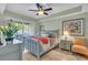 Serene bedroom with a gray bed frame, access to a patio and tiled floor at 702 Granada Ave # 7, Venice, FL 34285