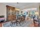 Elegant dining room featuring a large wood table and a beautiful china cabinet at 702 Granada Ave # 7, Venice, FL 34285