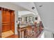 Interior view of a home with an elevator and wooden staircase at 702 Granada Ave # 7, Venice, FL 34285