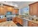 Modern kitchen with granite countertops and stainless steel appliances at 702 Granada Ave # 7, Venice, FL 34285