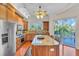 Updated kitchen with granite countertops, stainless steel appliances, and an island at 702 Granada Ave # 7, Venice, FL 34285