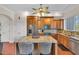Well-equipped kitchen featuring granite countertops and wooden cabinetry at 702 Granada Ave # 7, Venice, FL 34285