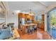 Modern kitchen with granite countertops, wooden cabinetry, and stainless steel appliances at 702 Granada Ave # 7, Venice, FL 34285