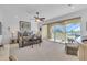 Main bedroom with balcony access and a ceiling fan at 702 Granada Ave # 7, Venice, FL 34285