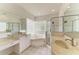 Bathroom with double vanity, soaking tub and shower at 7023 Chickasaw Bayou Rd, Bradenton, FL 34203